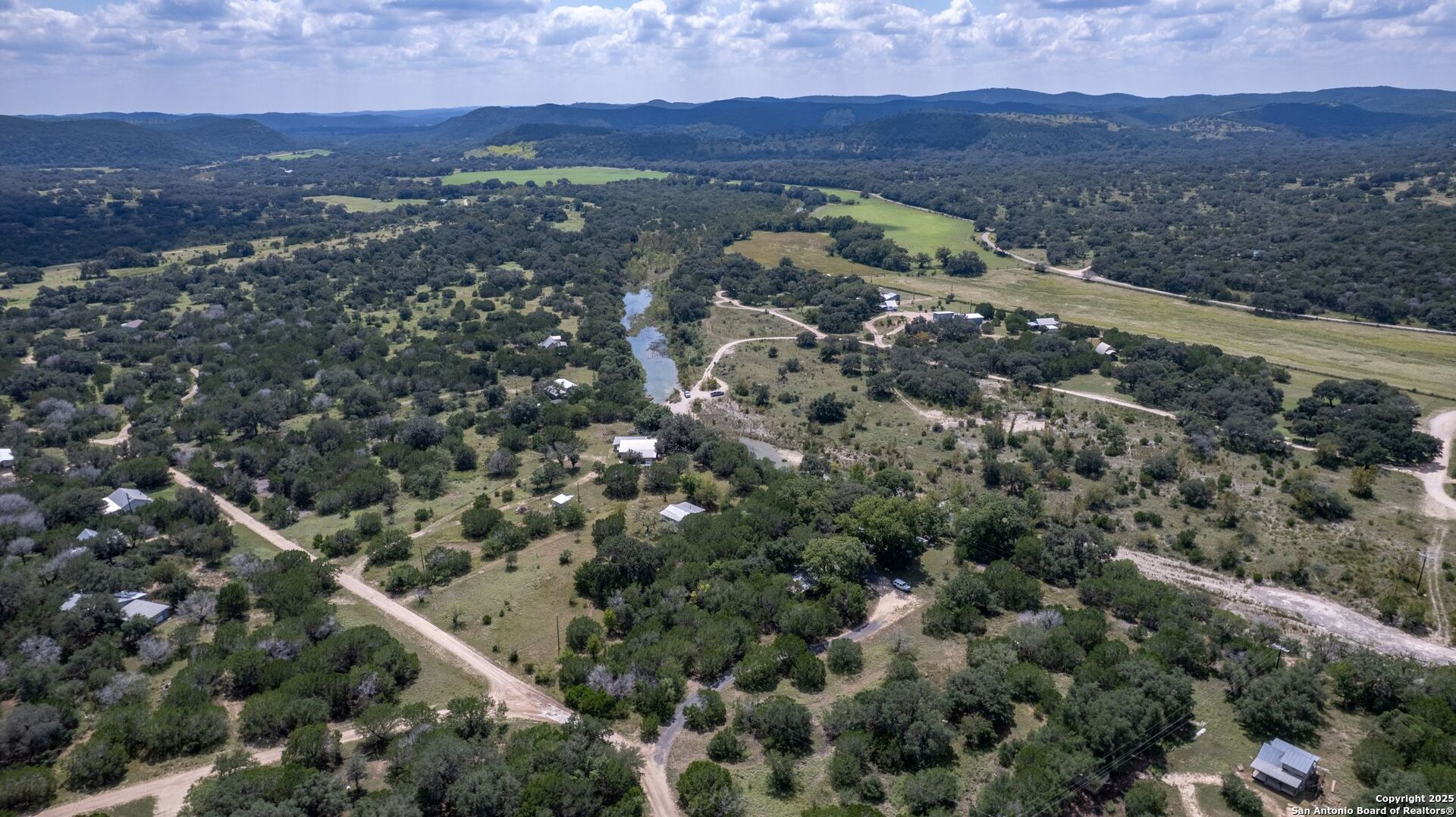 394 Squirrel Bend Uvalde, TX 78801 - Photo 51 of 80 an aerial view of mountain with residential house and green space
