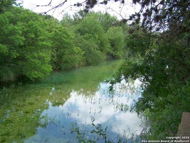 394 Squirrel Bend Uvalde, TX 78801 - Photo 80 of 80 a view of a lake from a yard