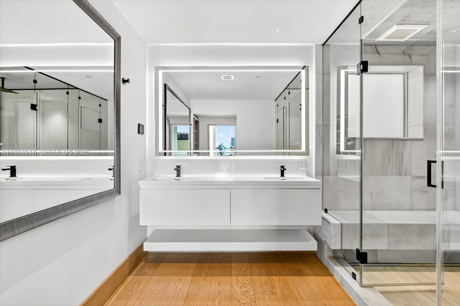 1201 20th Street, Unit PH07 Miami Beach, FL 33139 - Photo 13 of 30 a bathroom with a tub sink and mirror