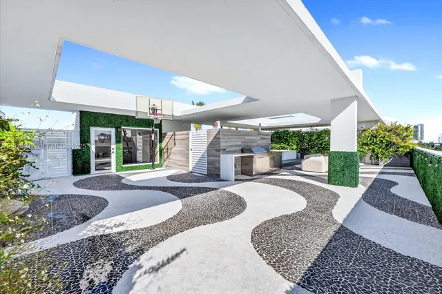 a view of a backyard with potted plants