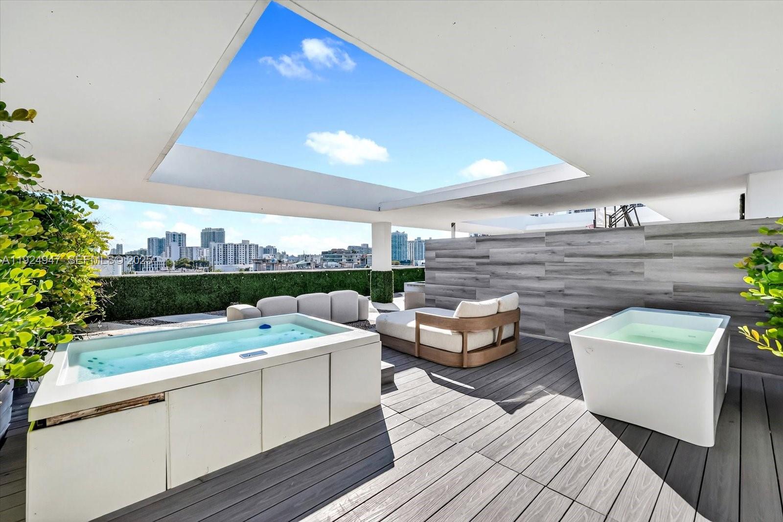 1201 20th Street, Unit PH07 Miami Beach, FL 33139 - Photo 20 of 30 a view of a terrace with couches and potted plants