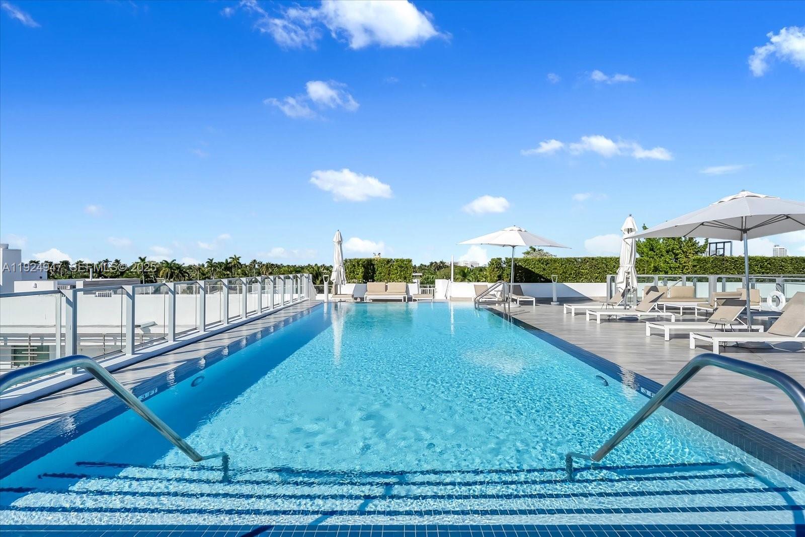 1201 20th Street, Unit PH07 Miami Beach, FL 33139 - Photo 22 of 30 a view of a swimming pool with lounge chair