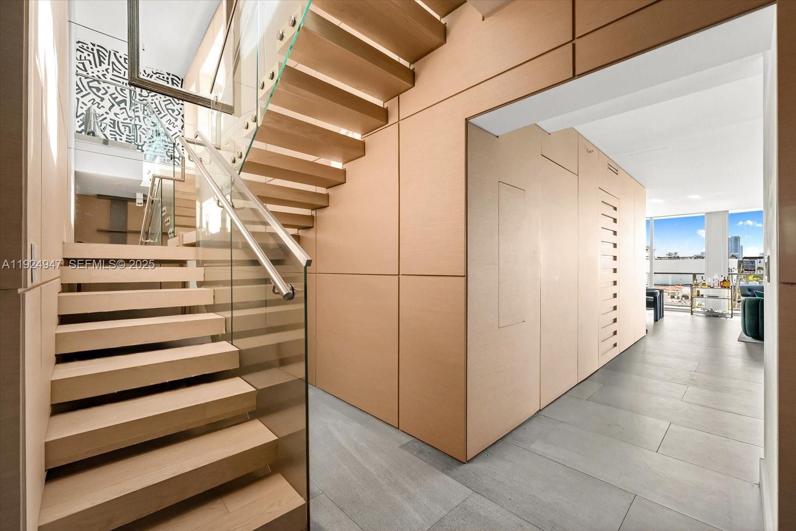 1201 20th Street, Unit PH07 Miami Beach, FL 33139 - Photo 27 of 30 a view of entryway and hall with wooden floor