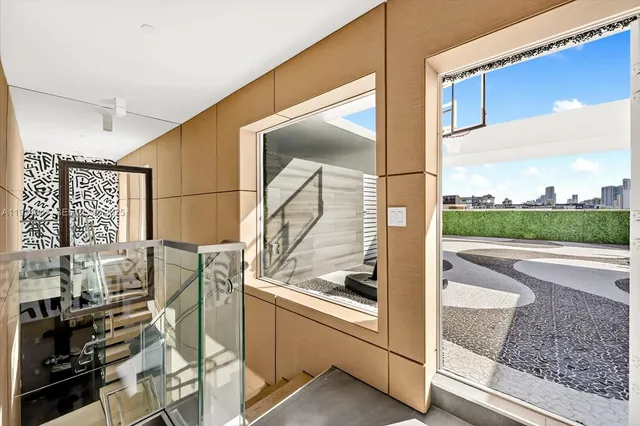 a view of a bathroom with a sink and a window