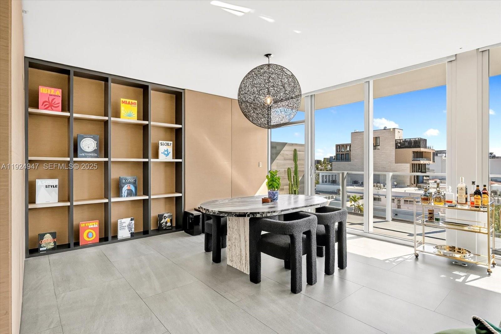 1201 20th Street, Unit PH07 Miami Beach, FL 33139 - Photo 6 of 30 a view of a dining room with furniture
