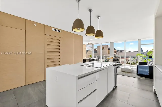 a kitchen with a stove a refrigerator and a stove