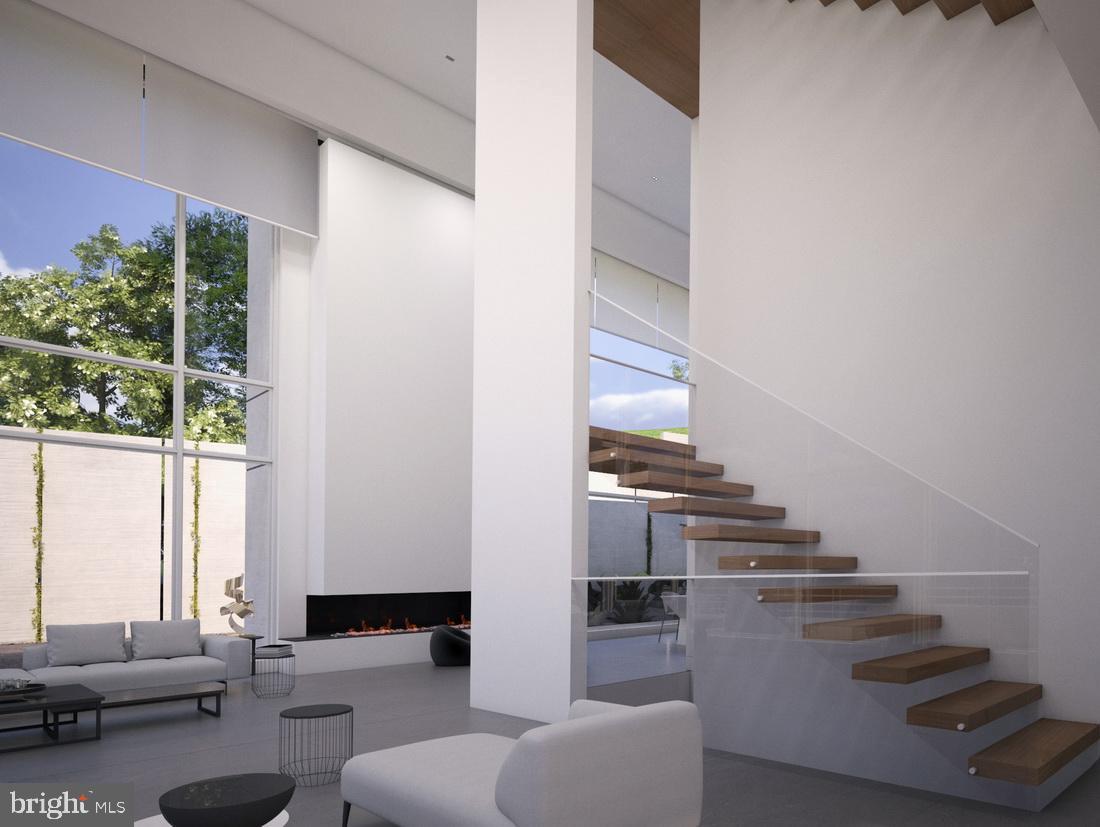 1311 Ranleigh Road McLean, VA 22101 - Photo 4 of 17 a living room with couches and kitchen view with wooden floor