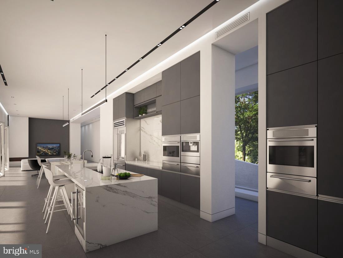 1311 Ranleigh Road McLean, VA 22101 - Photo 10 of 17 a kitchen with stainless steel appliances kitchen island granite countertop a refrigerator and a stove top oven