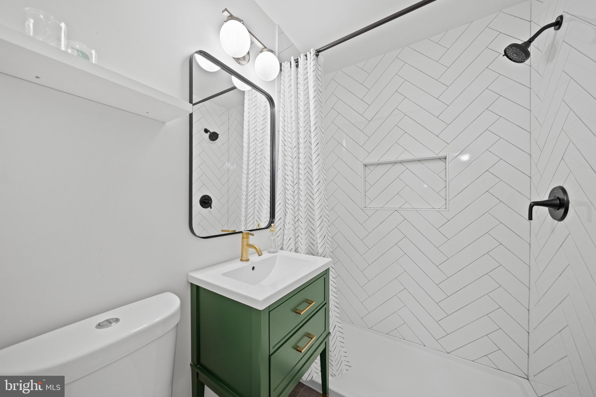 2837 Cameron Road Falls Church, VA 22042 - Photo 15 of 42 a bathroom with a sink a toilet and shower