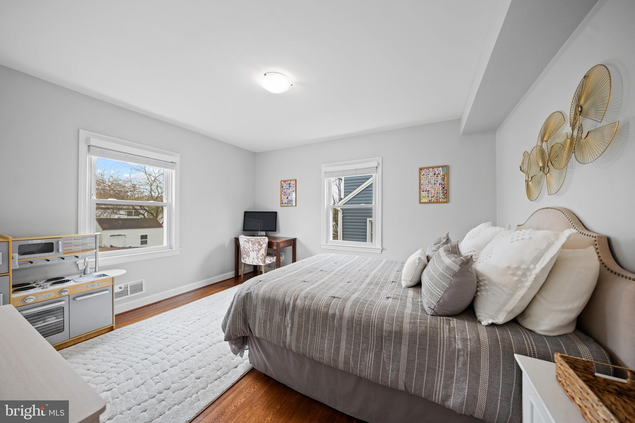 2837 Cameron Road Falls Church, VA 22042 - Photo 16 of 42 a bedroom with a bed and wooden floor