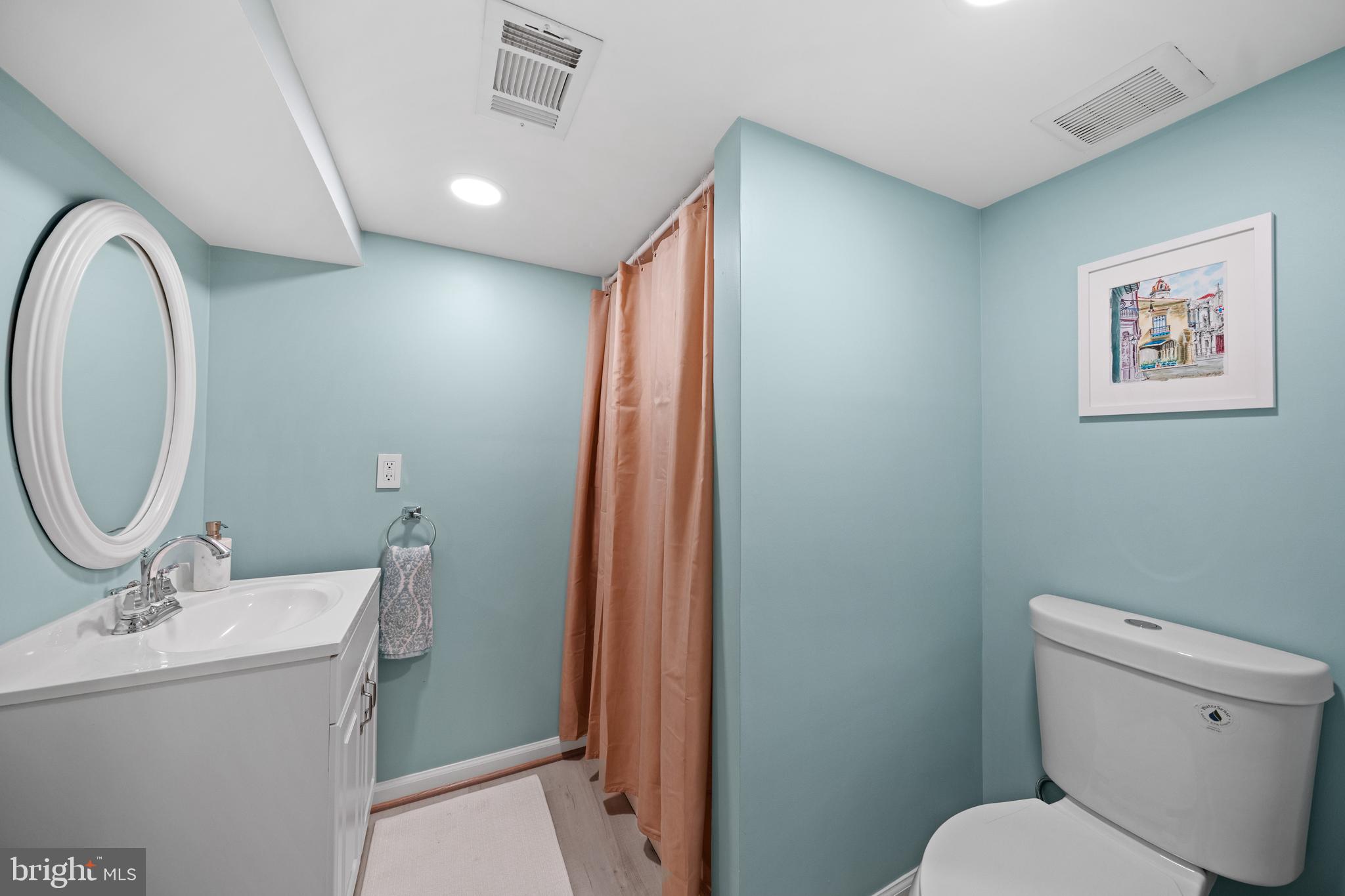 2837 Cameron Road Falls Church, VA 22042 - Photo 32 of 42 a bathroom with a toilet sink and mirror