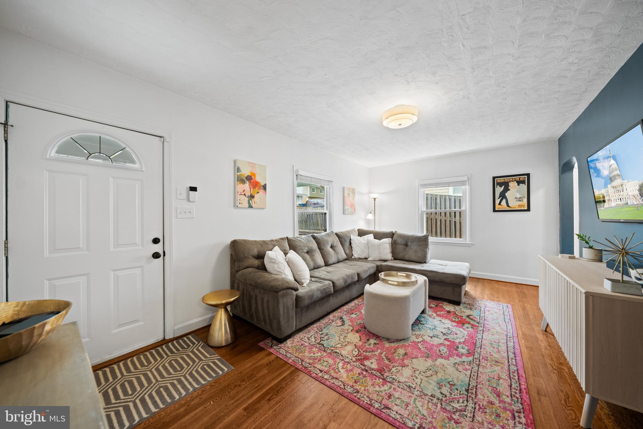 2837 Cameron Road Falls Church, VA 22042 - Photo 8 of 42 a living room with furniture a rug and a window