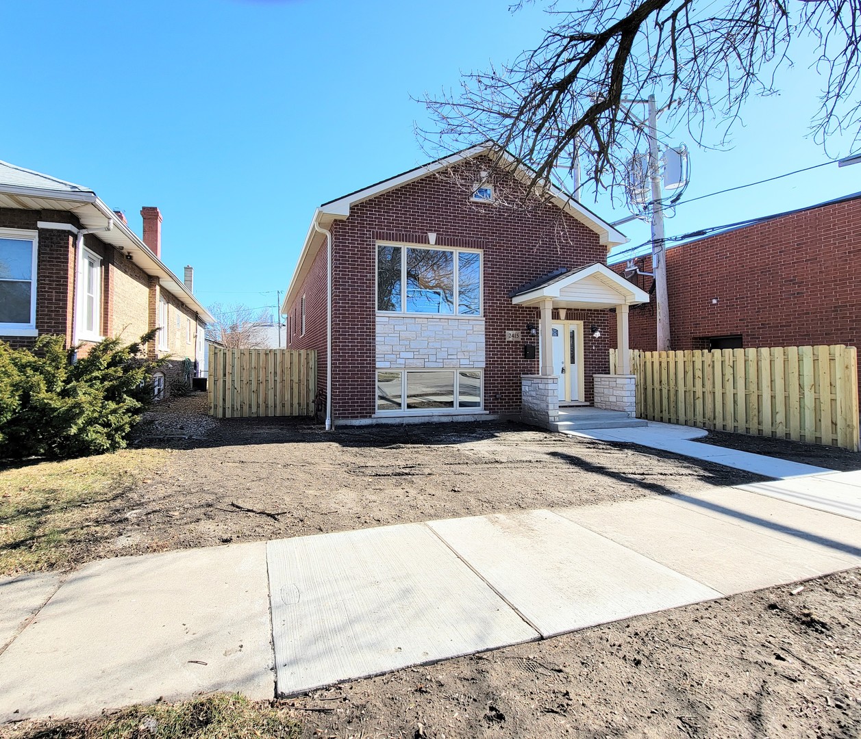 2415 North Newcastle Avenue Chicago, IL 60707 - Photo 1 of 22 a front view of a house with a yard and garage