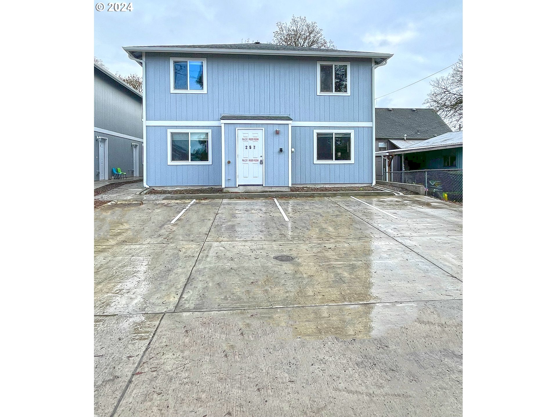 257 20th Avenue Longview, WA 98632 - Photo 11 of 16 a view of a house with a yard and garage