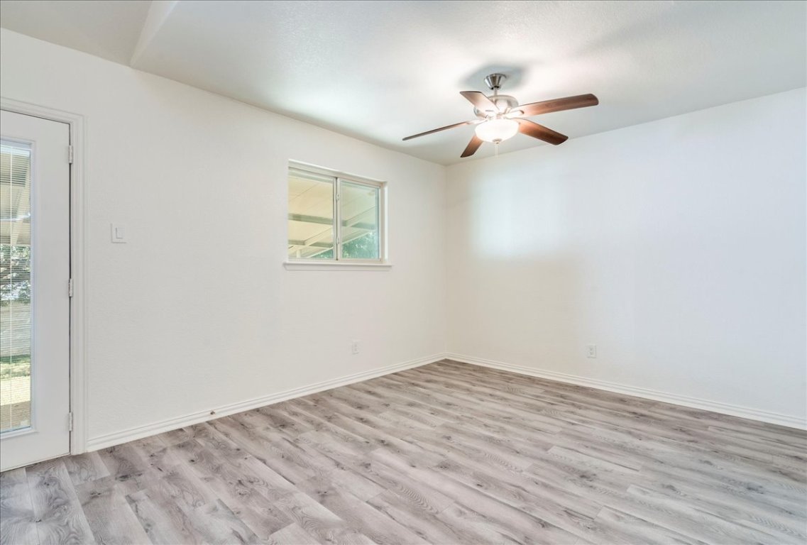 706 Windsor Road Round Rock, TX 78664 - Photo 11 of 29 a view of empty room with wooden floor