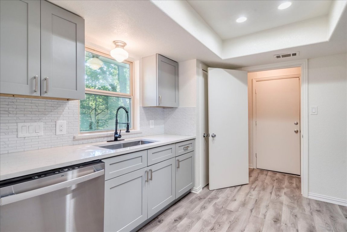 706 Windsor Road Round Rock, TX 78664 - Photo 12 of 29 a kitchen with a sink and a window