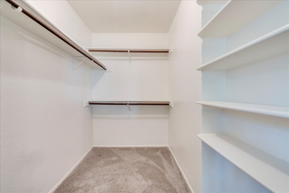 706 Windsor Road Round Rock, TX 78664 - Photo 18 of 29 a view of an empty walk in closet