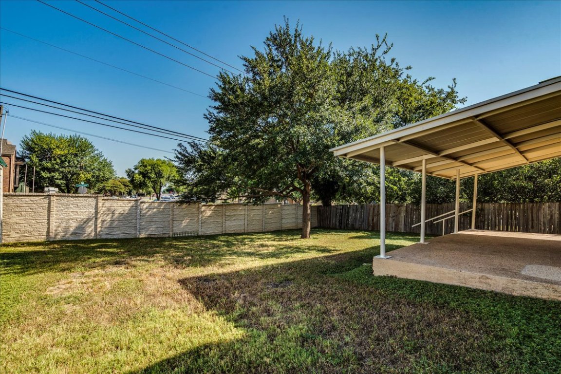 706 Windsor Road Round Rock, TX 78664 - Photo 25 of 29 a view of a backyard with a small cabin