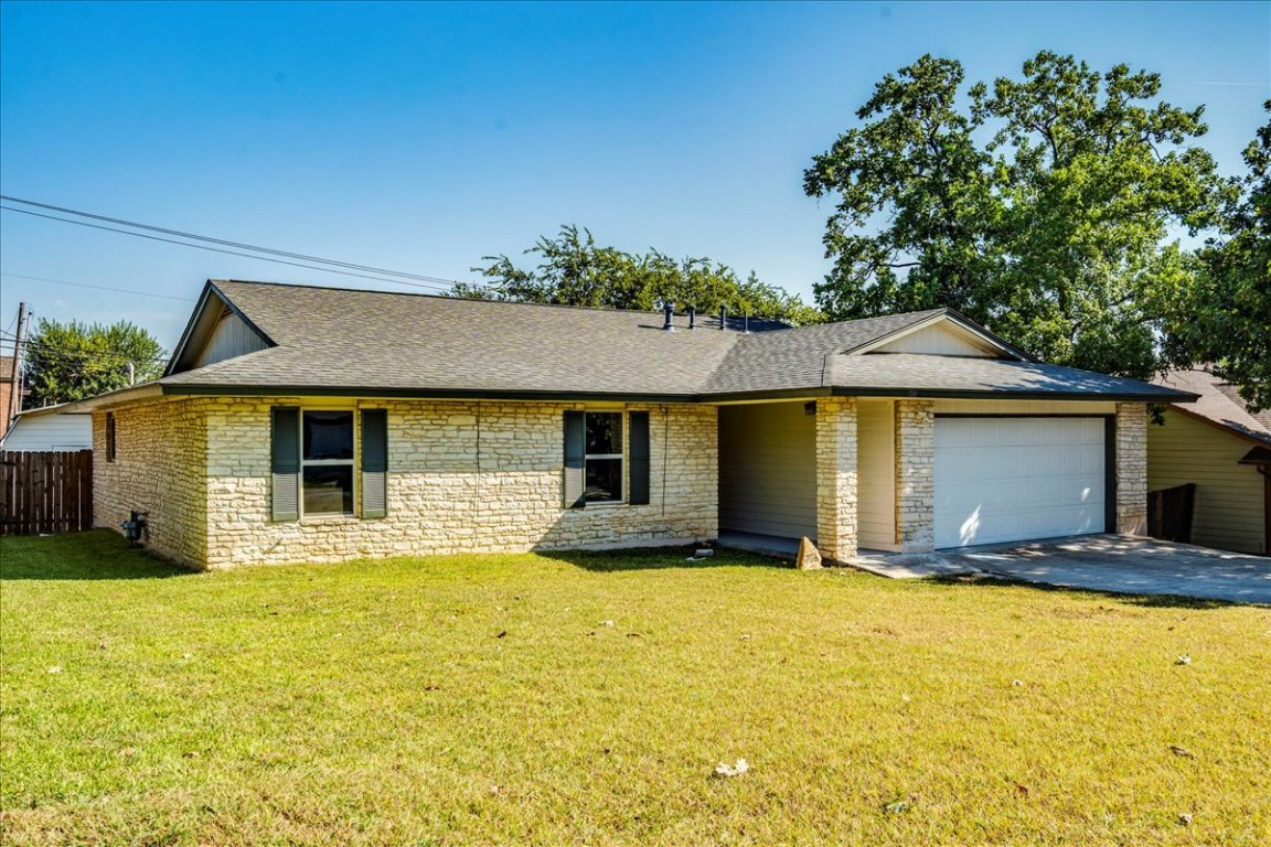 706 Windsor Road Round Rock, TX 78664 - Photo 3 of 29 a view of a house with a yard