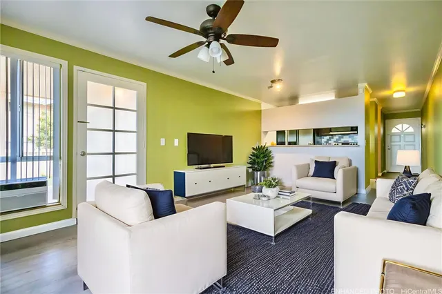 a living room with fireplace furniture and a flat screen tv