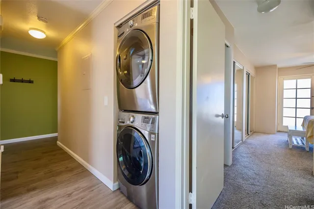 a view of a hallway with washer and dryer