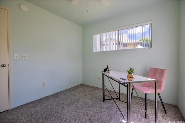 a view of a room with furniture wooden floor and a window