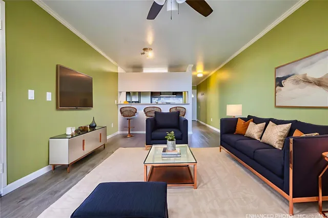 a living room with furniture and a flat screen tv
