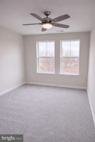 a bathroom with a shower a toilet and a shower