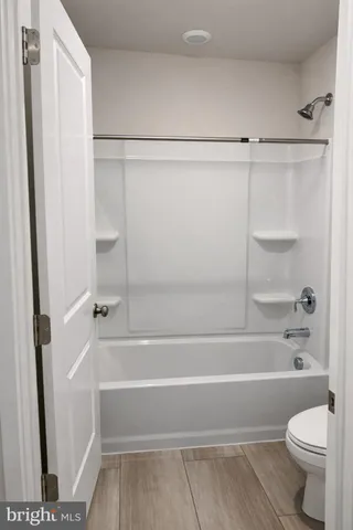 a bathroom with a sink vanity and granite