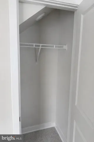 a view of an empty walk in closet