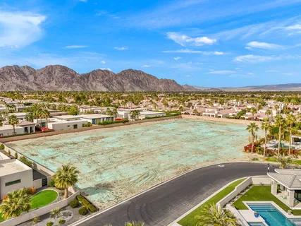 a view of a town with mountains in the background