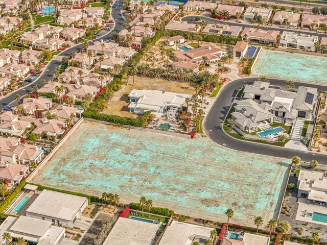 a view of a town with large trees