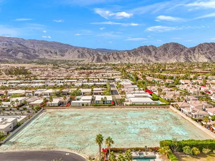 an aerial view of house with yard