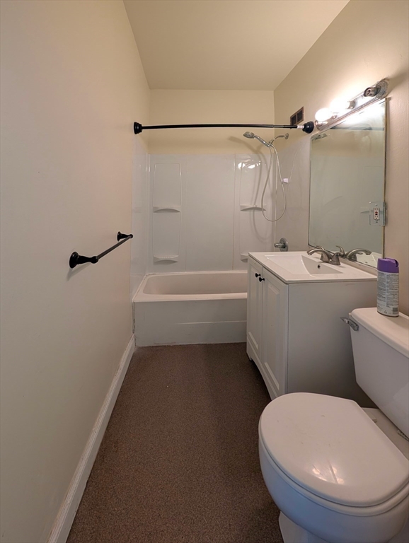 140 Chestnut Street, Unit 207 Springfield, MA 01103 - Photo 9 of 13 a bathroom with a toilet a sink and bathtub