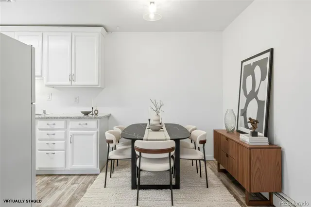 a dining room with furniture and window