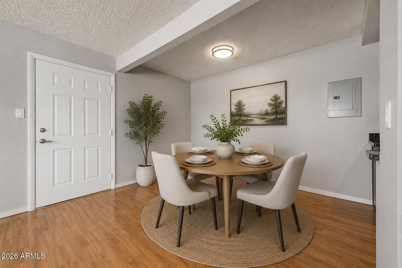 424 West Brown Road, Unit 248 Mesa, AZ 85201 - Photo 3 of 19 a view of a dining room with furniture and wooden floor