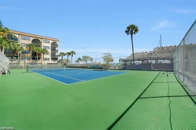a view of a swimming pool with outdoor seating