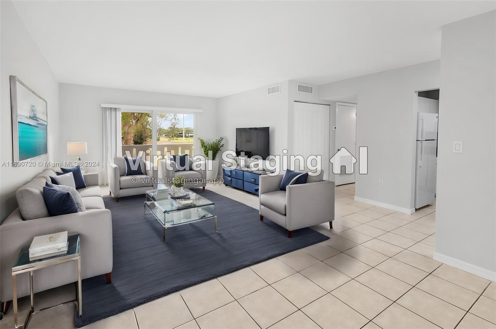 7430 Miami Lakes Drive, Unit E302 Miami Lakes, FL 33014 - Photo 1 of 29 a living room with furniture and a flat screen tv