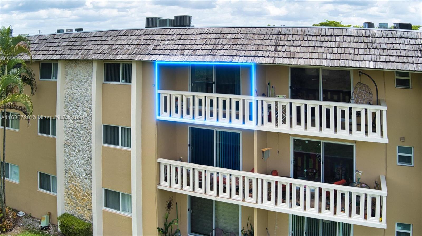7430 Miami Lakes Drive, Unit E302 Miami Lakes, FL 33014 - Photo 19 of 29 a view of a large building with a window