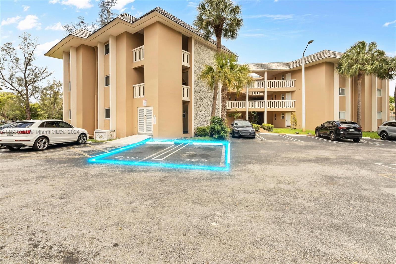 7430 Miami Lakes Drive, Unit E302 Miami Lakes, FL 33014 - Photo 20 of 29 a view of car parked in front of house