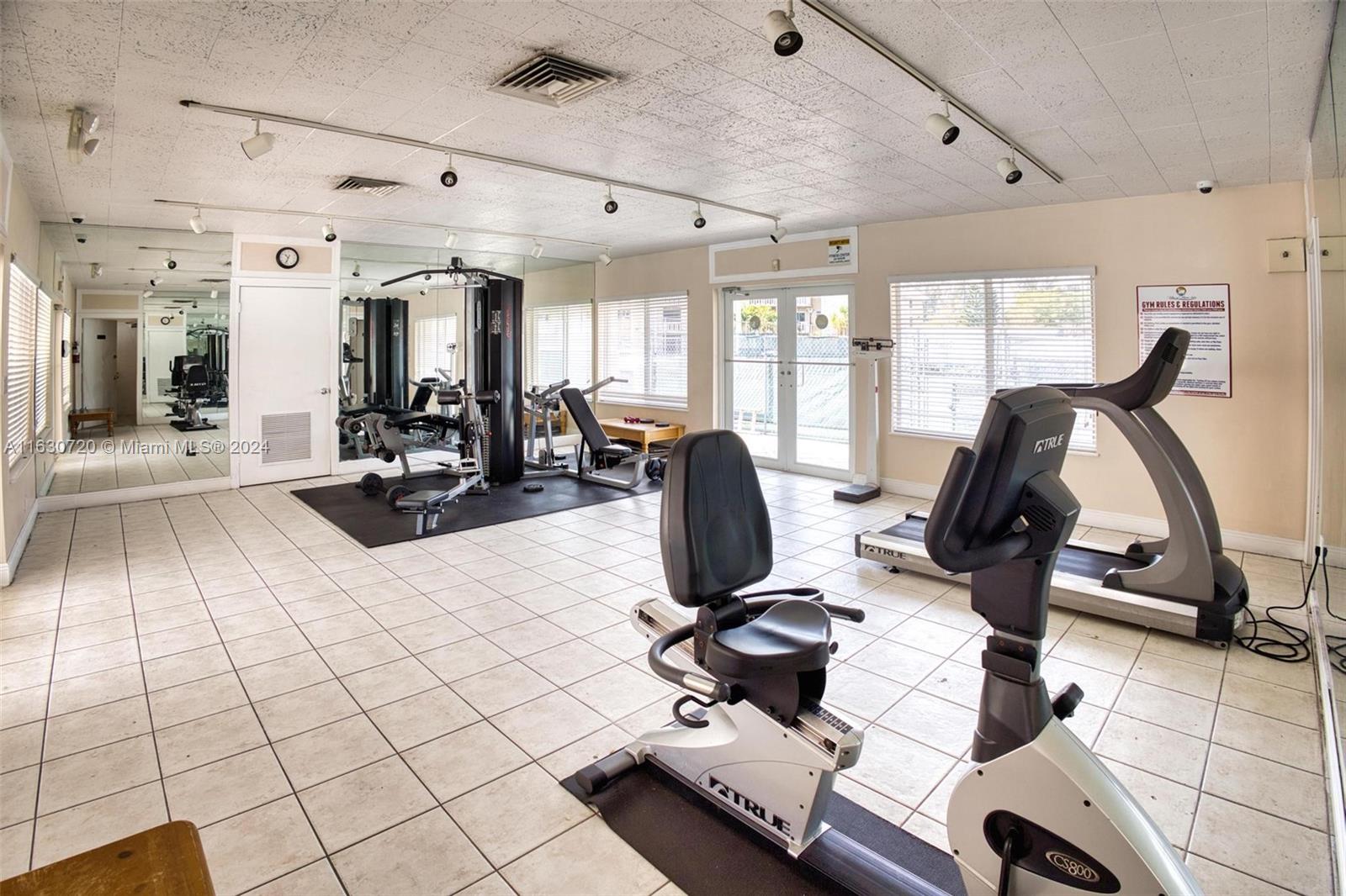 7430 Miami Lakes Drive, Unit E302 Miami Lakes, FL 33014 - Photo 25 of 29 a view of a room with gym equipment