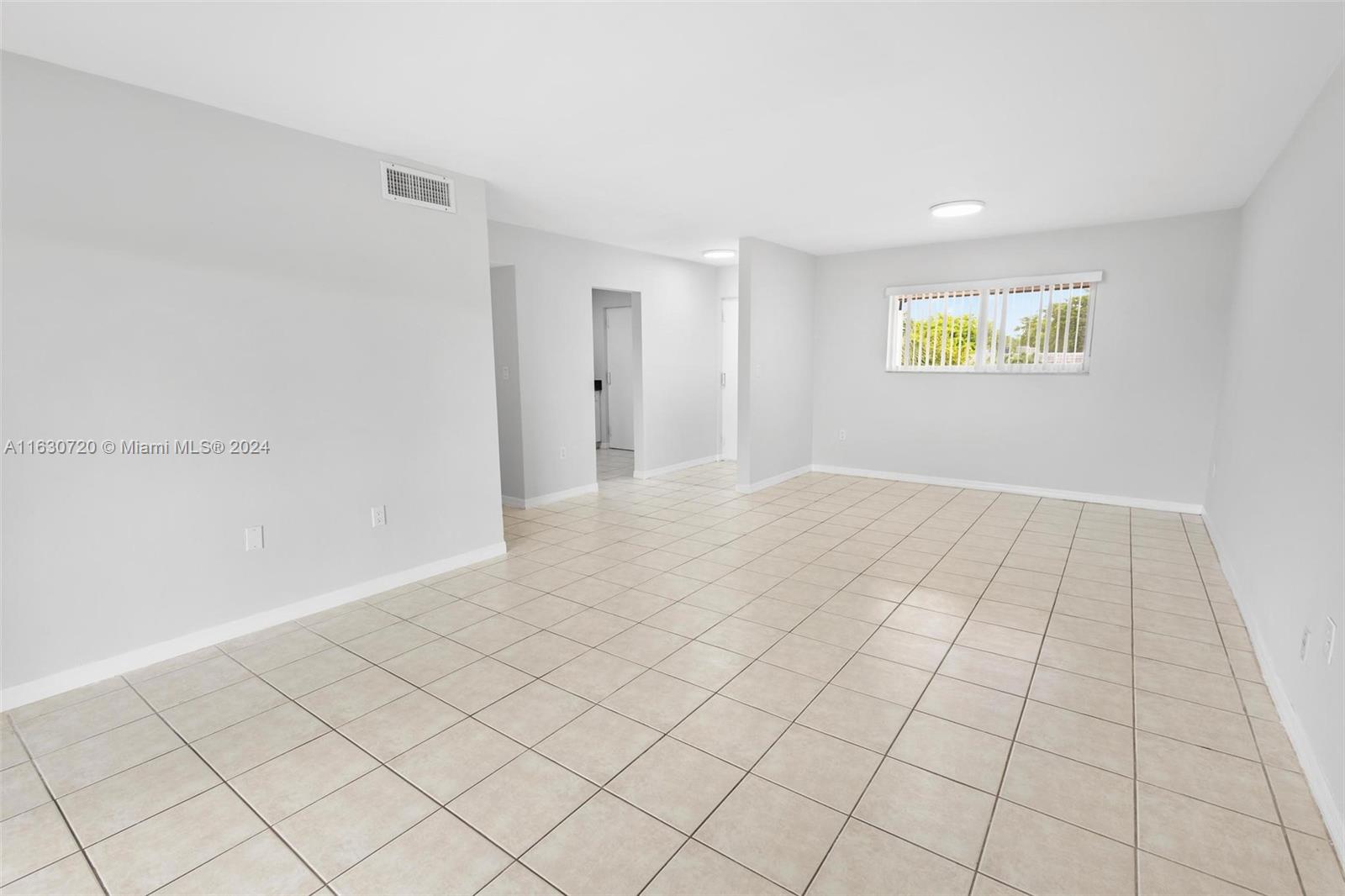 7430 Miami Lakes Drive, Unit E302 Miami Lakes, FL 33014 - Photo 8 of 29 a view of an empty room and window