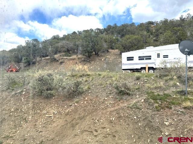 30022 Rd L Mancos, CO 81328 - Photo 16 of 16 a backyard of a house with table and chairs