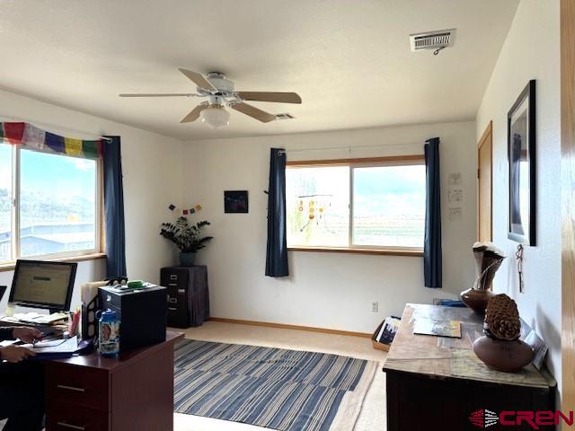 30022 Rd L Mancos, CO 81328 - Photo 4 of 16 a view of a workspace with furniture and a window