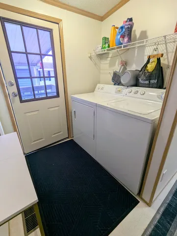 a bathroom with a sink and wooden floor