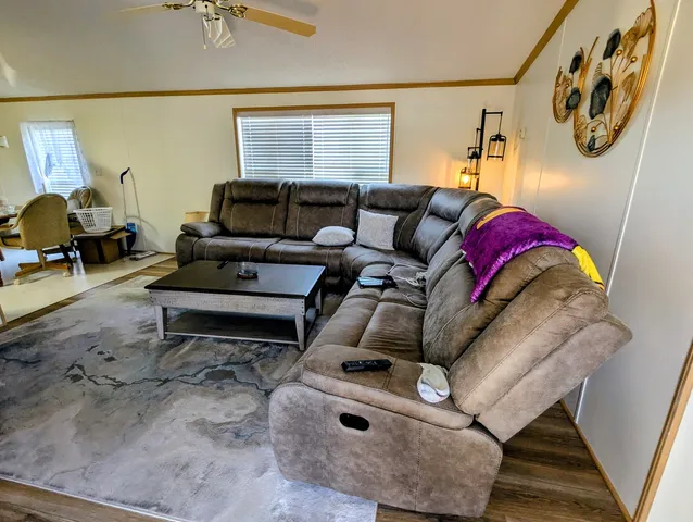 a living room with furniture and a window