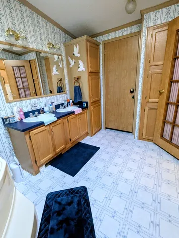 a bedroom with a bed window and walk in closet