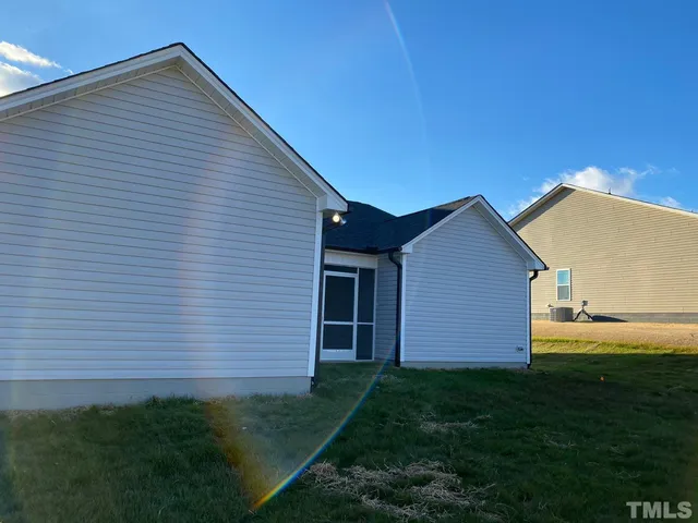 a view of front of house with a yard