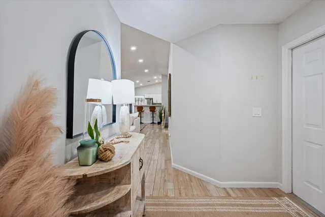 a view of living room filled with furniture and potted plant