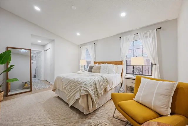 a bedroom with a bed and couch